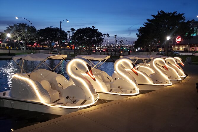 Illuminated Swan Boat Night Ride on Rainbow Lagoon in Long Beach - Sunset, skyline, and the Ferris wheel